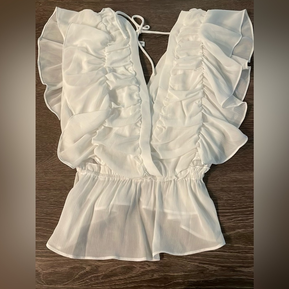 White ruffled blouse